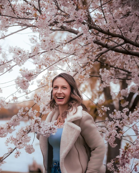 Outdoor portrait surrounded by spring blossoms